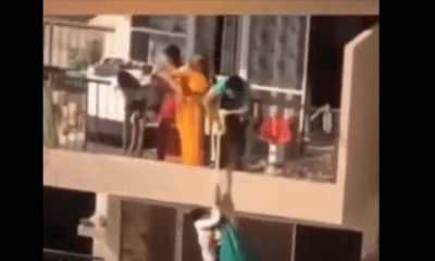 مشهد يحبس الأنفاس.. أم تخاطر بابنها لاستعادة ردائها وترفعه بالملاءة من الطابق التاسع للعاشر (فيديو)
